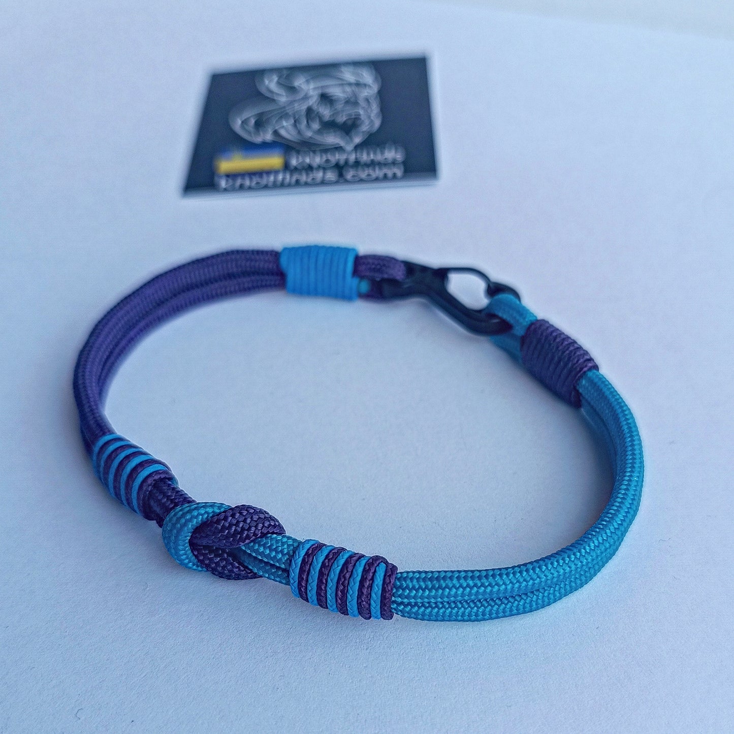 Turquoise and purple thin Nordic paracord bangle with a carabiner. Made of parachute cord and celtic knots. Gift to a friend for his birthday.