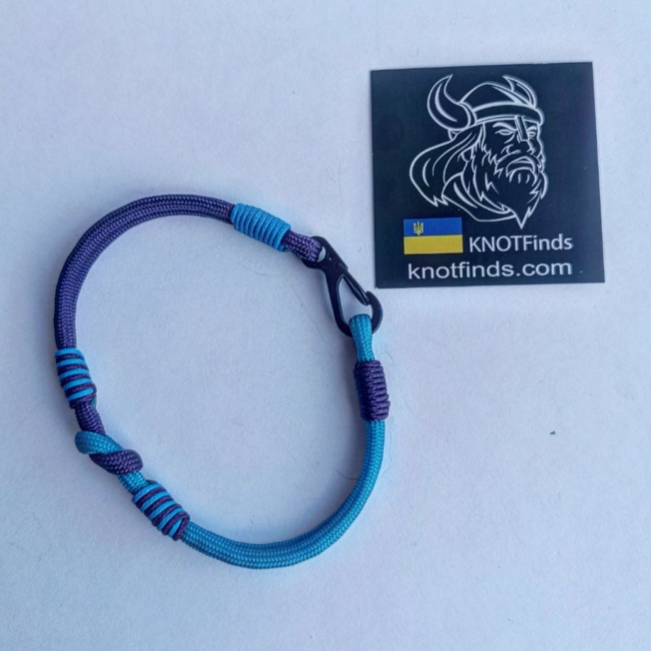 Turquoise and purple thin Nordic paracord bangle with a carabiner. Made of parachute cord and celtic knots. Gift to a friend for his birthday.