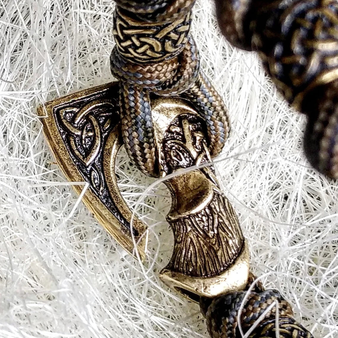 Viking bracelet made of paracord, Celtic knots and original beads made of brass with the image of ancient Scandinavian patterns. Mens style.