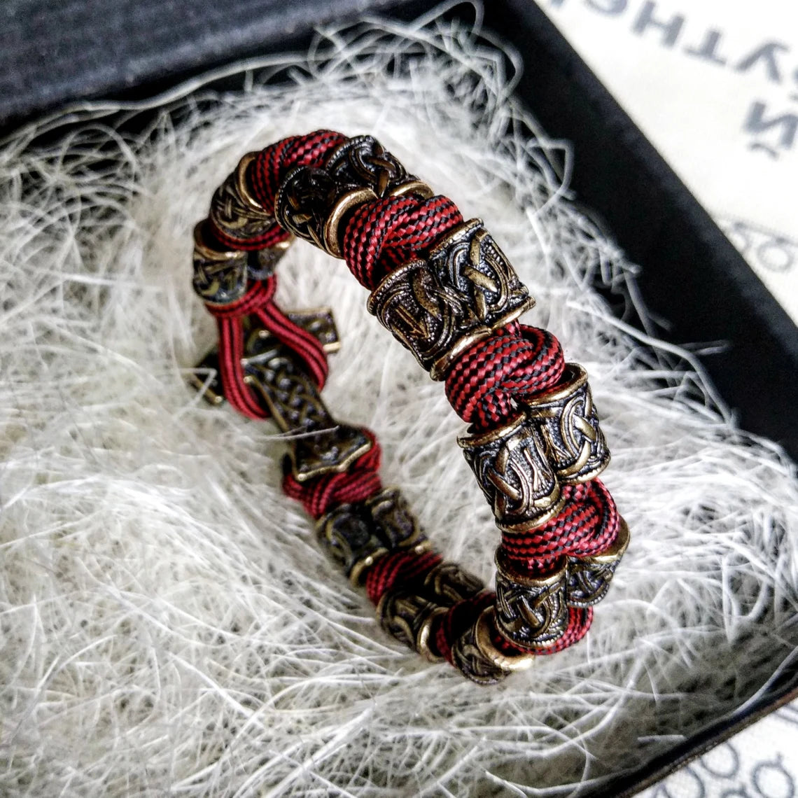 Runic bracelet "VIKING" from a paracord with a clasp "THOR'S HAMMER". Runes "teyvaz" and "algiz". Viking style.