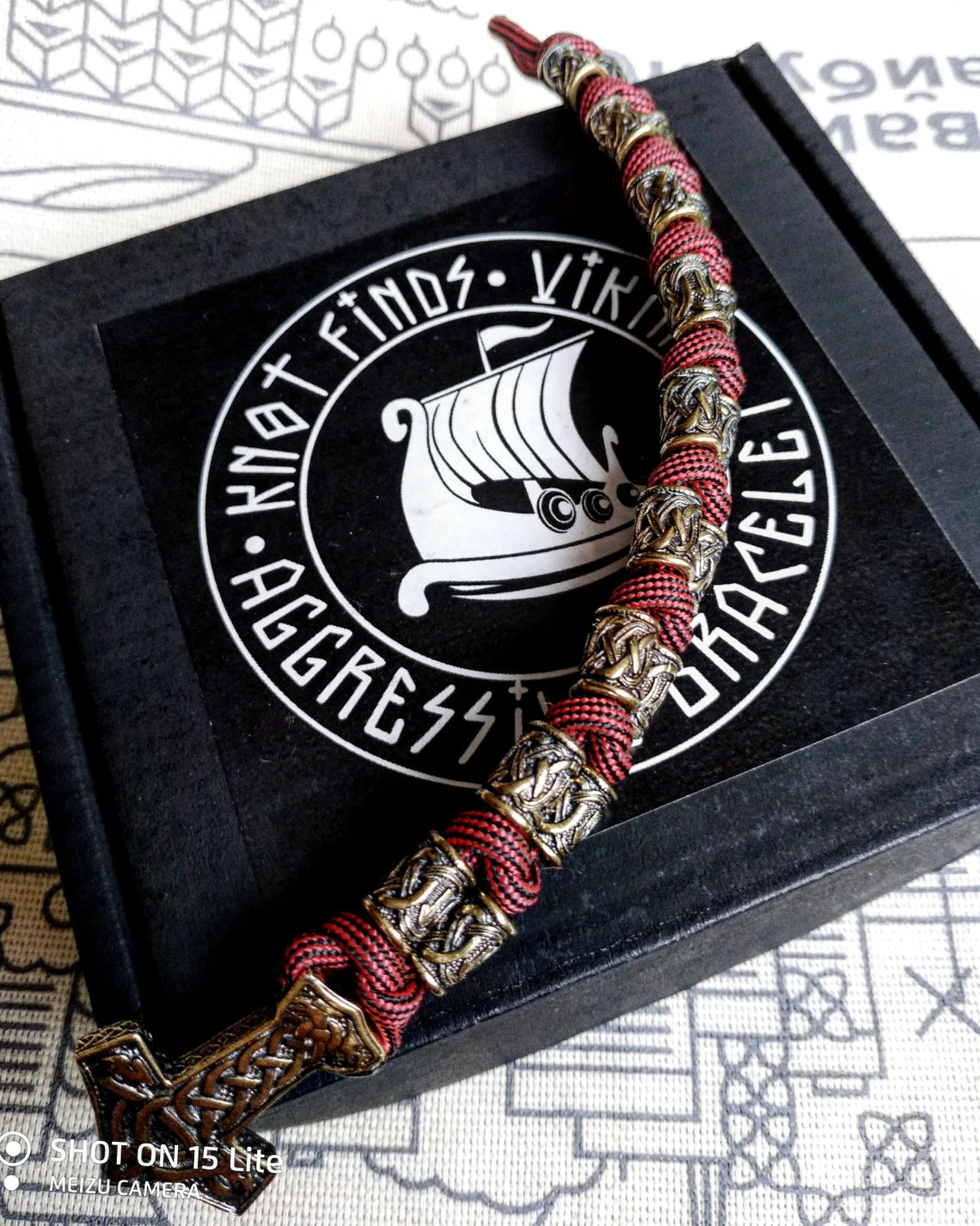 Runic bracelet "VIKING" from a paracord with a clasp "THOR'S HAMMER". Runes "teyvaz" and "algiz". Viking style.