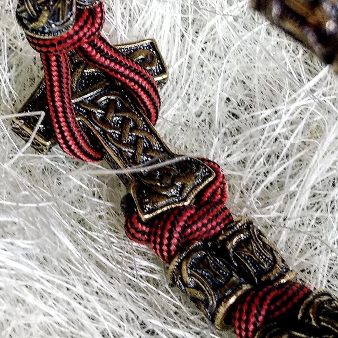 Runic bracelet "VIKING" from a paracord with a clasp "THOR'S HAMMER". Runes "teyvaz" and "algiz". Viking style.