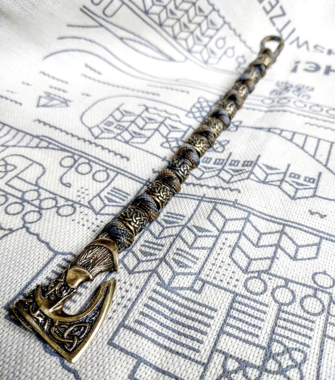 Viking bracelet made of paracord, Celtic knots and original beads made of brass with the image of ancient Scandinavian patterns. Mens style.