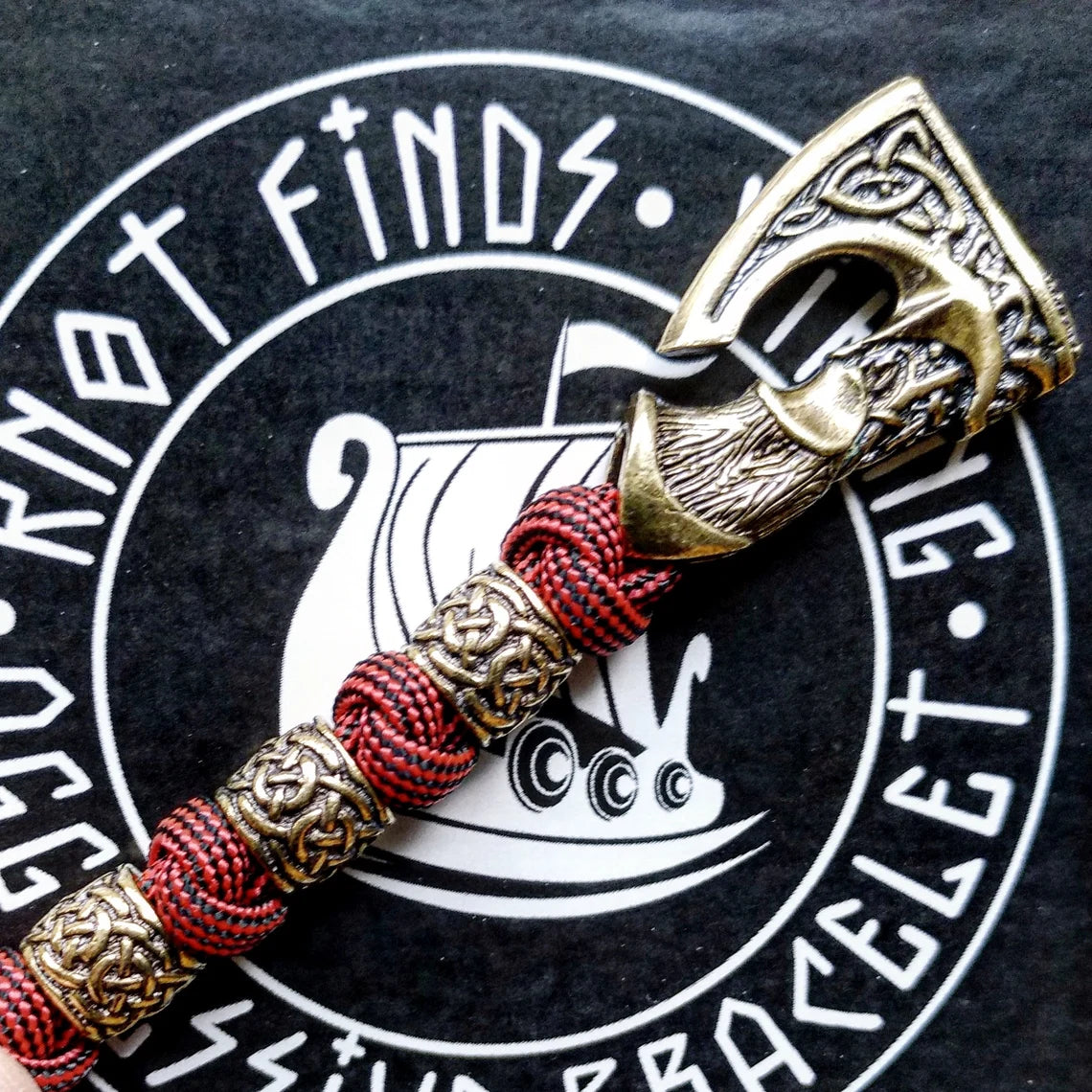 Viking bracelet made of paracord, Celtic knots and original beads made of brass with the image of ancient Scandinavian patterns. Mens style.
