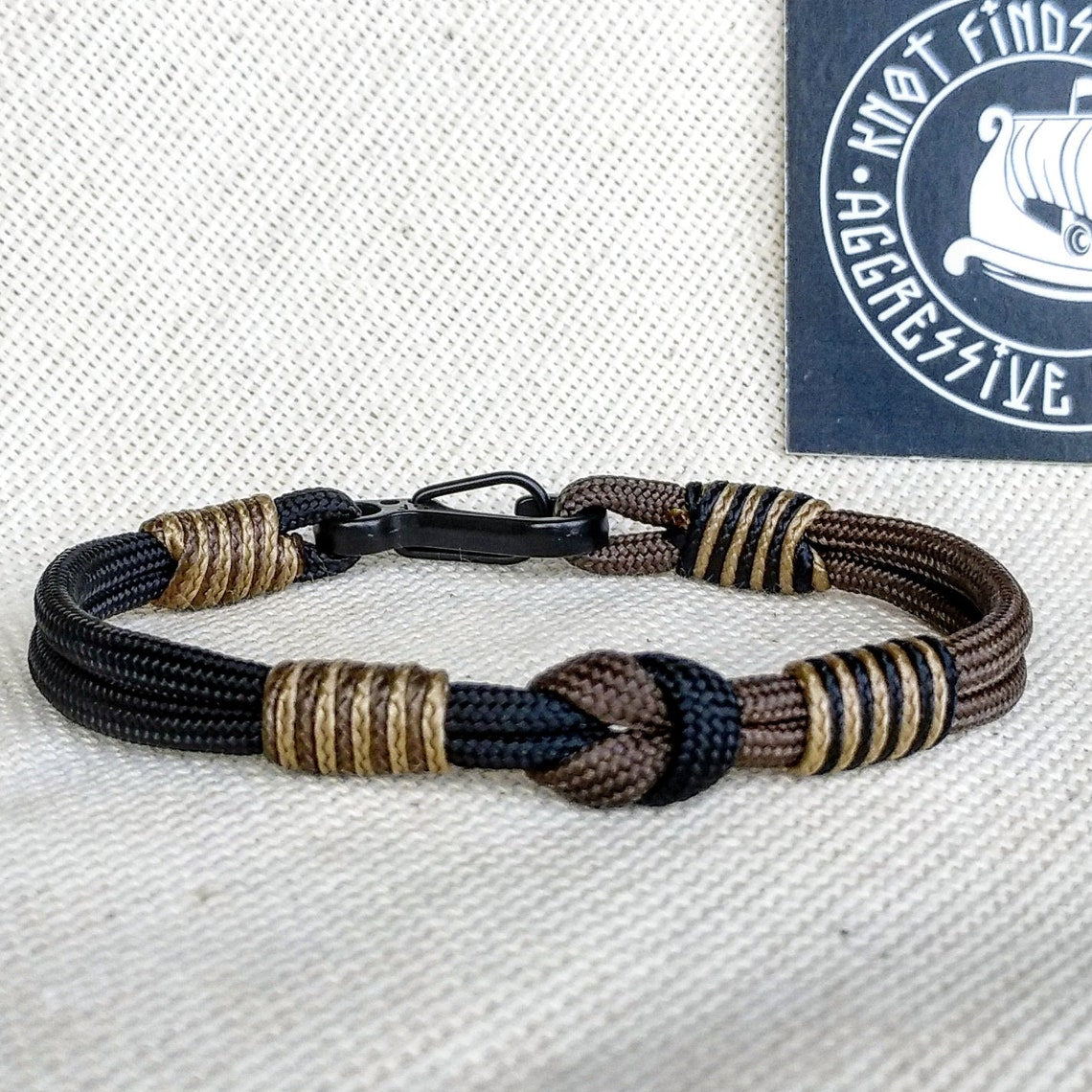 Thin Viking paracord bracelet with a carabiner. Made of parachute cord and celtic knots. Gift to a friend for his birthday.