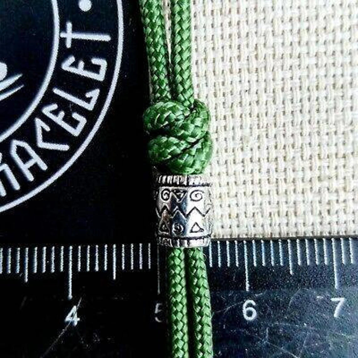 Charming bracelet, Paracord jewelry. Paracord bracelet with beads. Beads with ornaments.