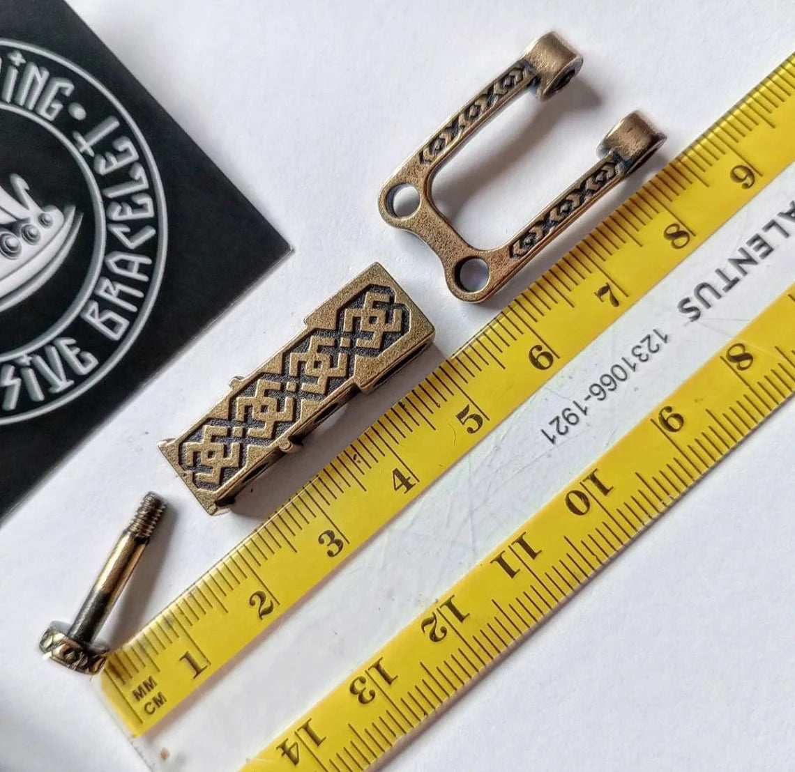 Bracelet lock. Paracord Buckles, U-shaped buckle. Viking-style paracord beads. Viking jewelry, manual casting. Scandinavian symbol.