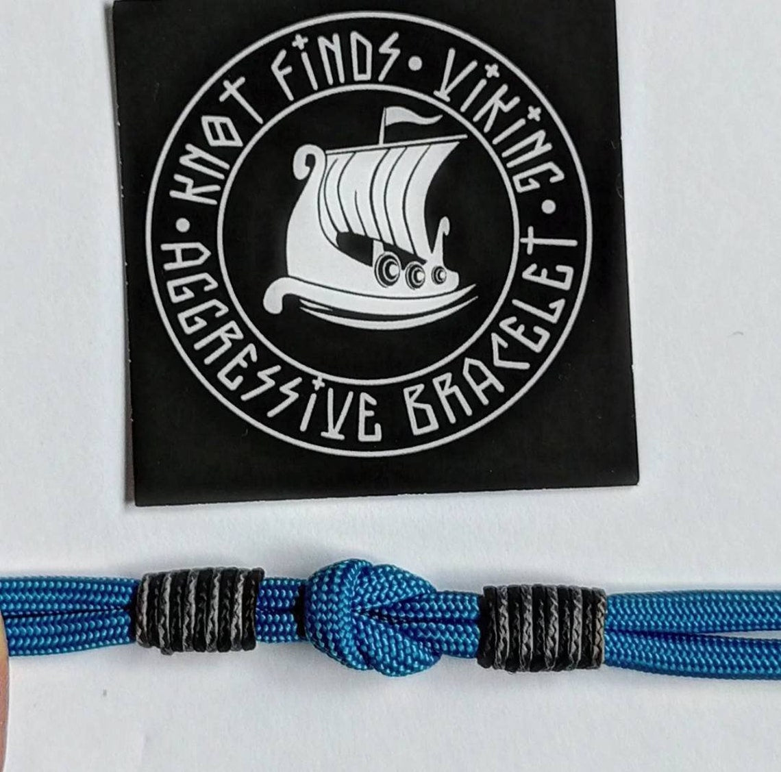 Thin military bracelet made of paracord and carabine for men. Royal blue collection. Navy style.