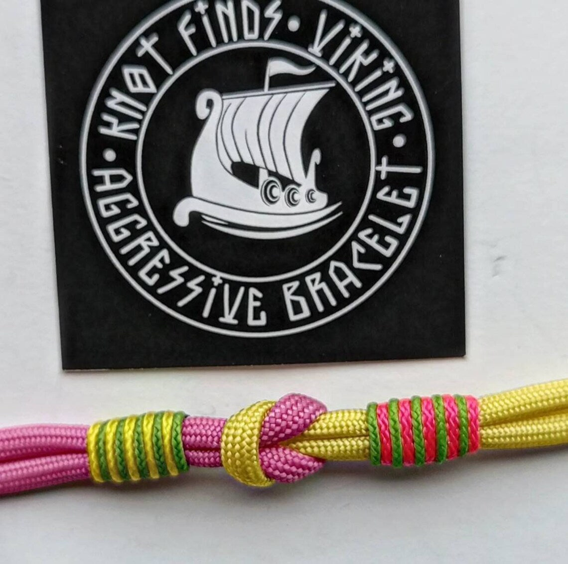 Pink and yellow thin Nordic paracord bangle with a carabiner. Made of parachute cord and celtic knots. Gift for women's.n's to