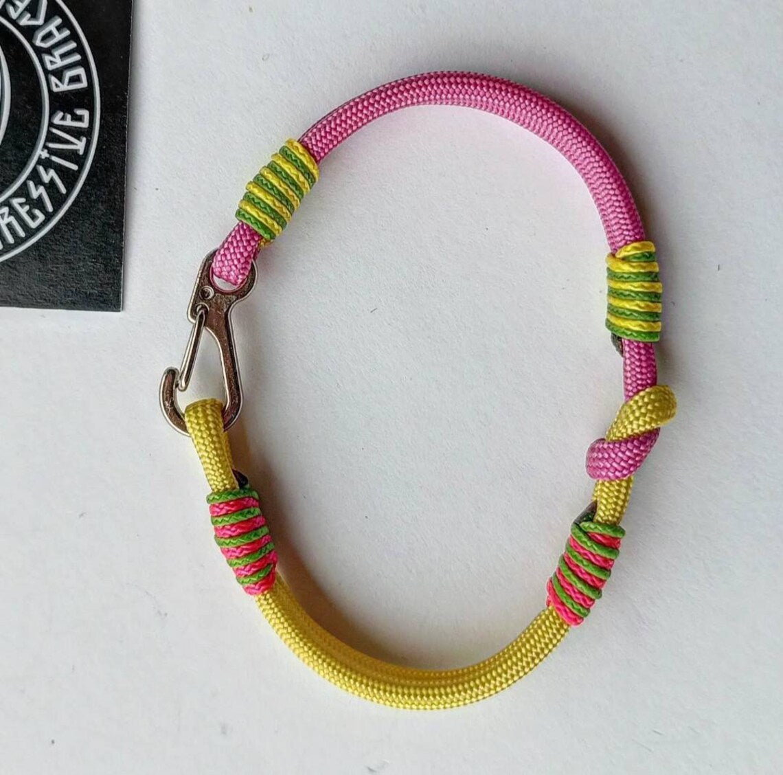 Pink and yellow thin Nordic paracord bangle with a carabiner. Made of parachute cord and celtic knots. Gift for women's.n's to