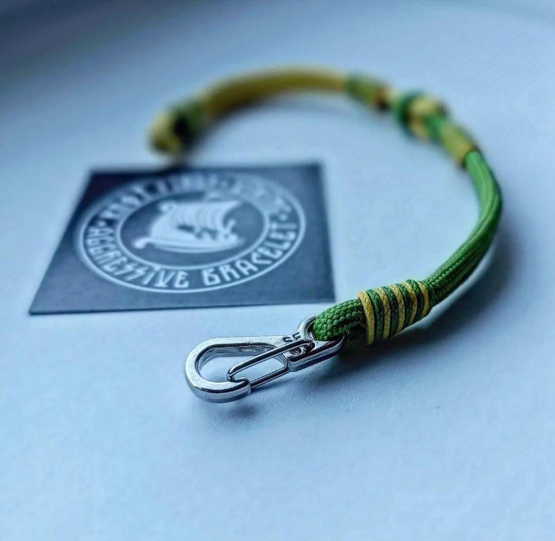 Thin yellow and green mint Nordic paracord bangle with a carabiner. Extreme durable. Gift to a friend for his birthday.