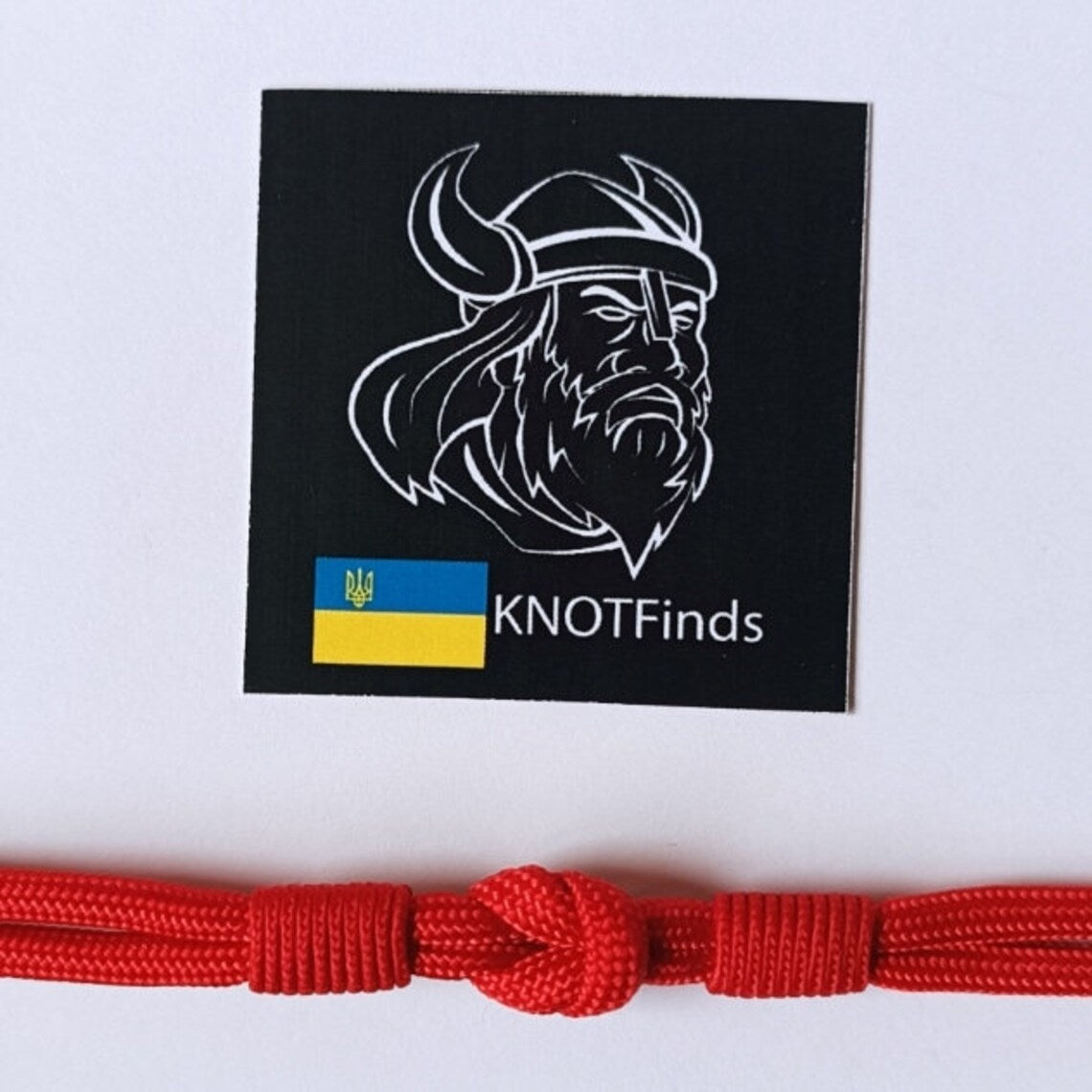 Thin legendary red bracelet. Made of paracord and carabine for men and women. Mystical style. Viking jewelry.