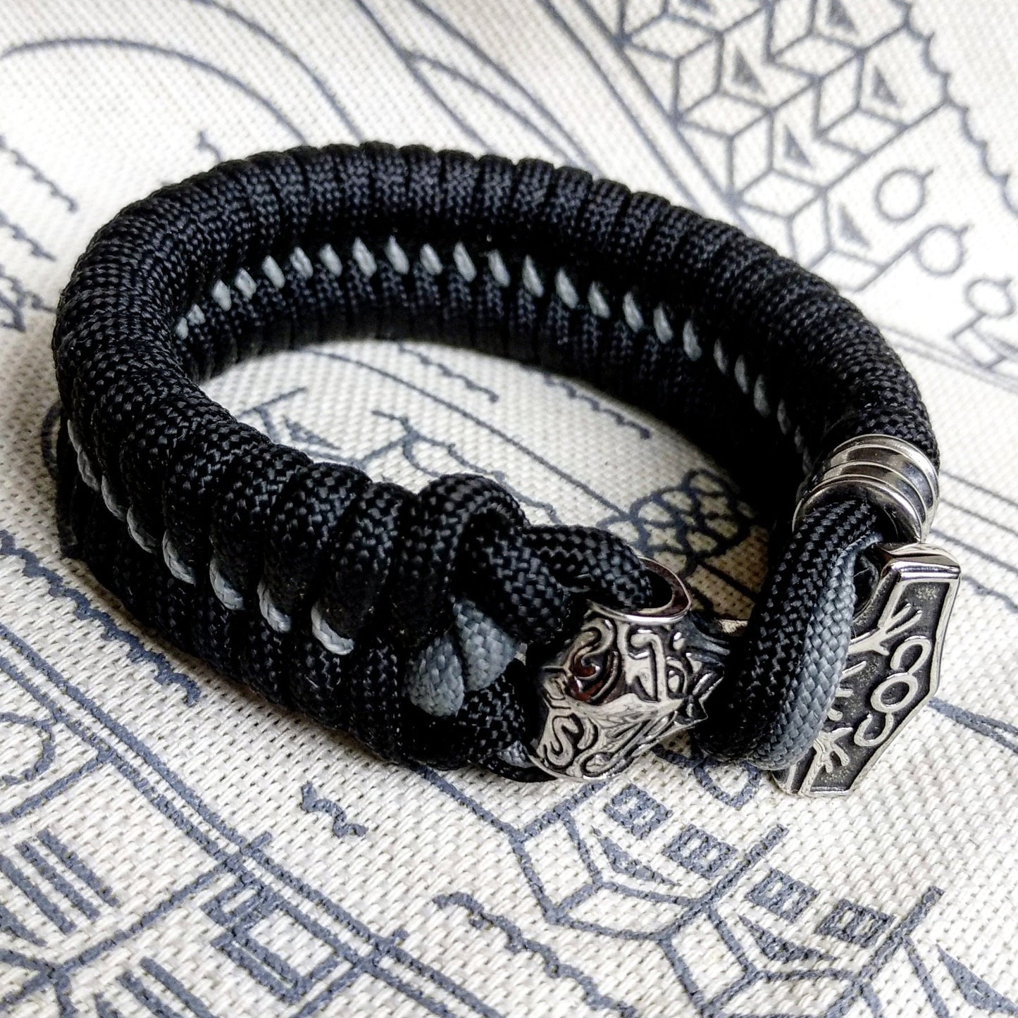 Black Nordic paracord bracelet "THOR'S HAMMER". A gift for men. Scandinavian style, Celtic knot.