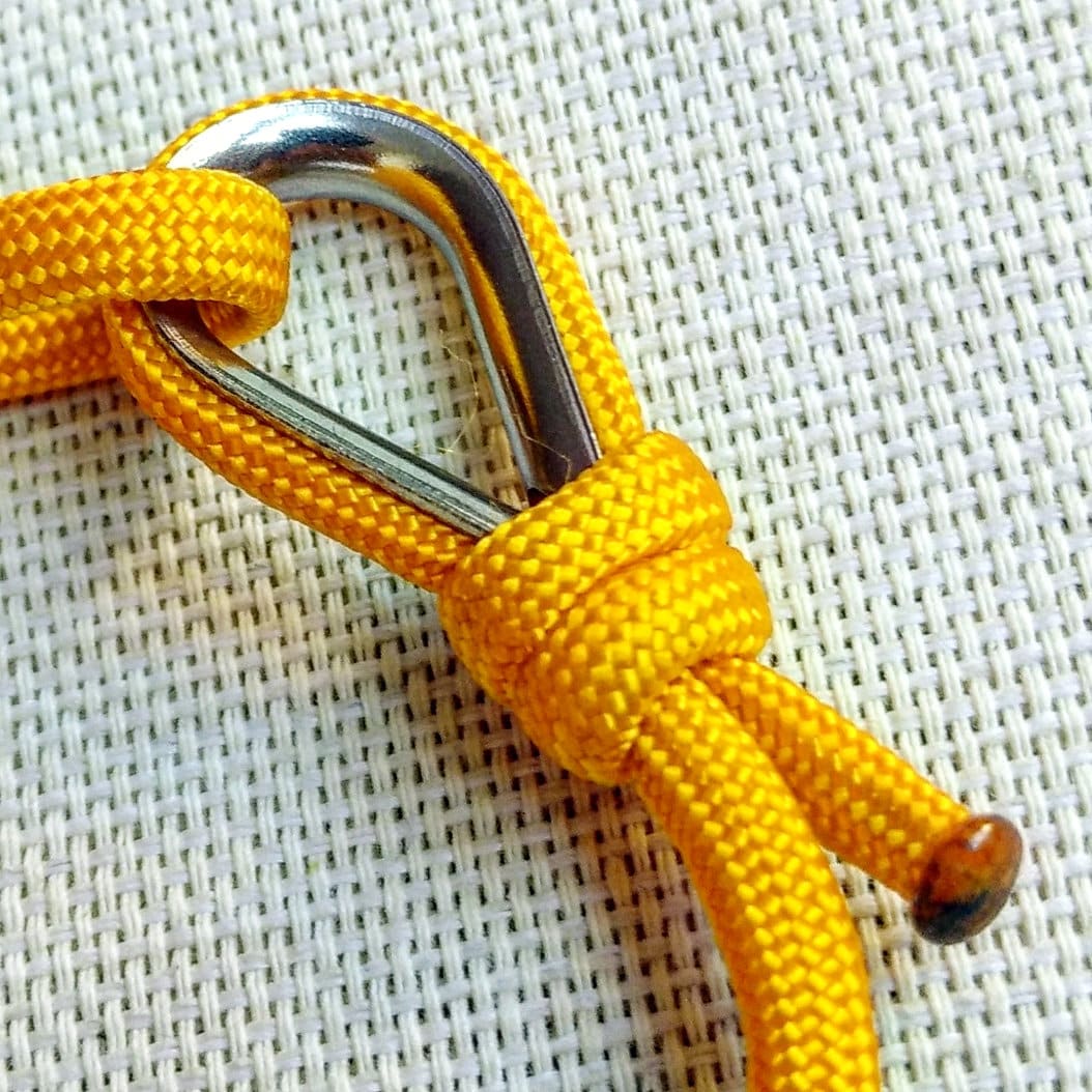 Yellow thin bracelet made of paracord and Celtic knots. Stylish bracelet for men and women. A gift for a surfer, diver, skydiver.