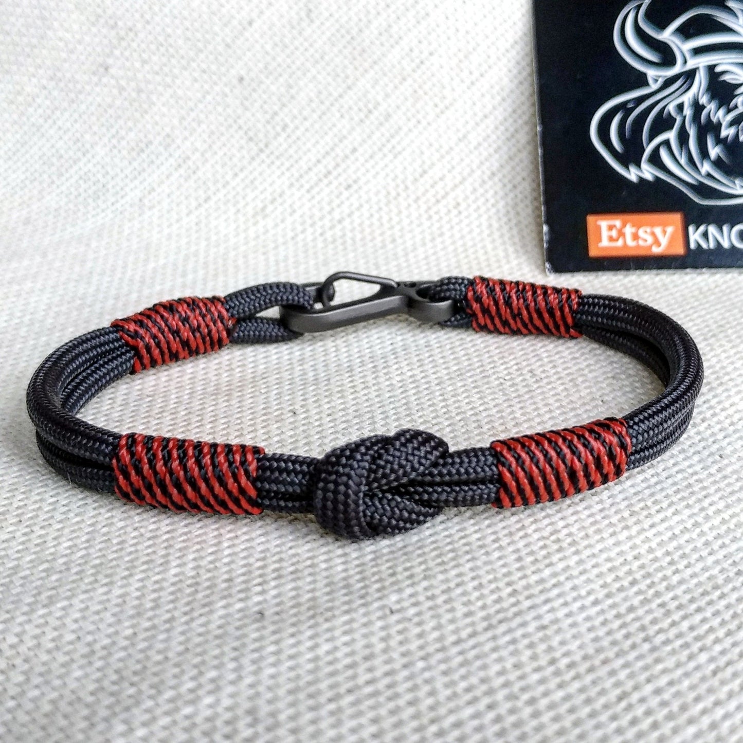 Handmade paracord bracelet made of Celtic knots, carbine and paracord. Nordic viking style.