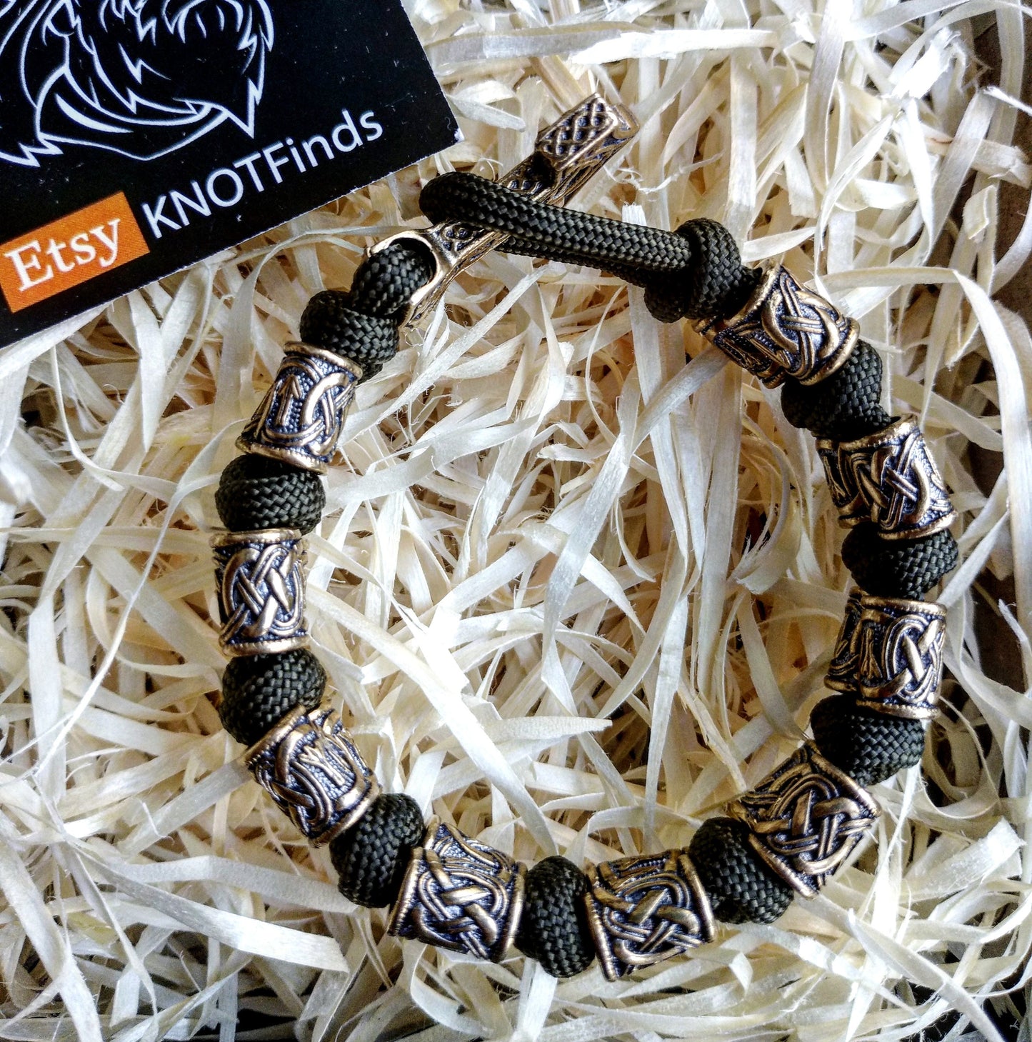Runic bracelet "VIKING" from a paracord with a clasp "THOR'S HAMMER". Runes "teyvaz" and "algiz". Viking style.