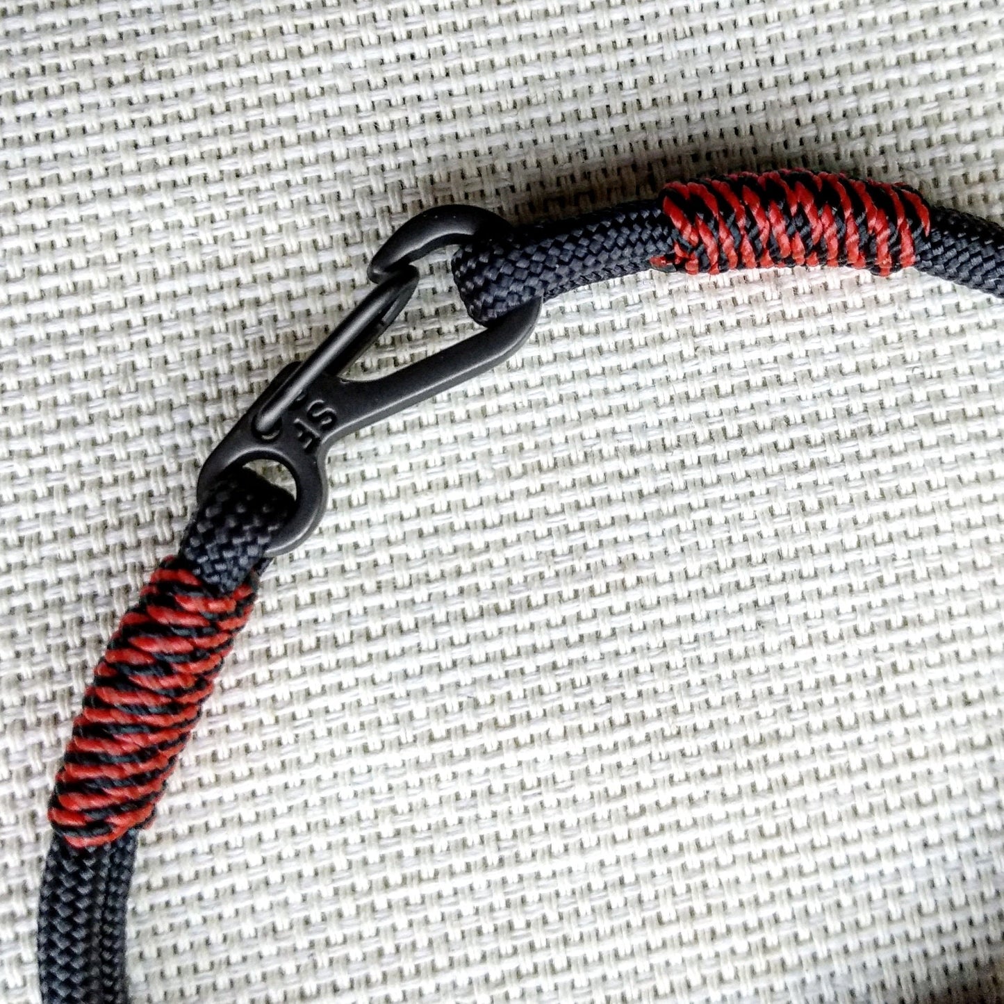 Handmade paracord bracelet made of Celtic knots, carbine and paracord. Nordic viking style.