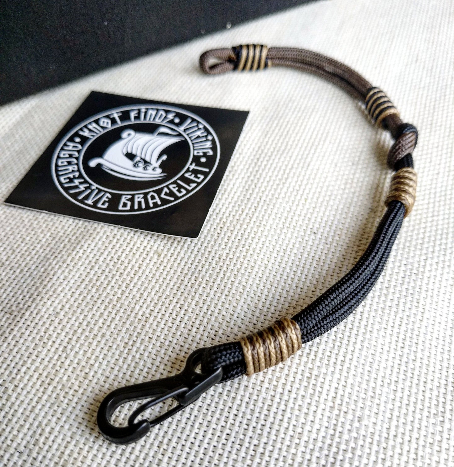 Thin Viking paracord bracelet with a carabiner. Made of parachute cord and celtic knots. Gift to a friend for his birthday.