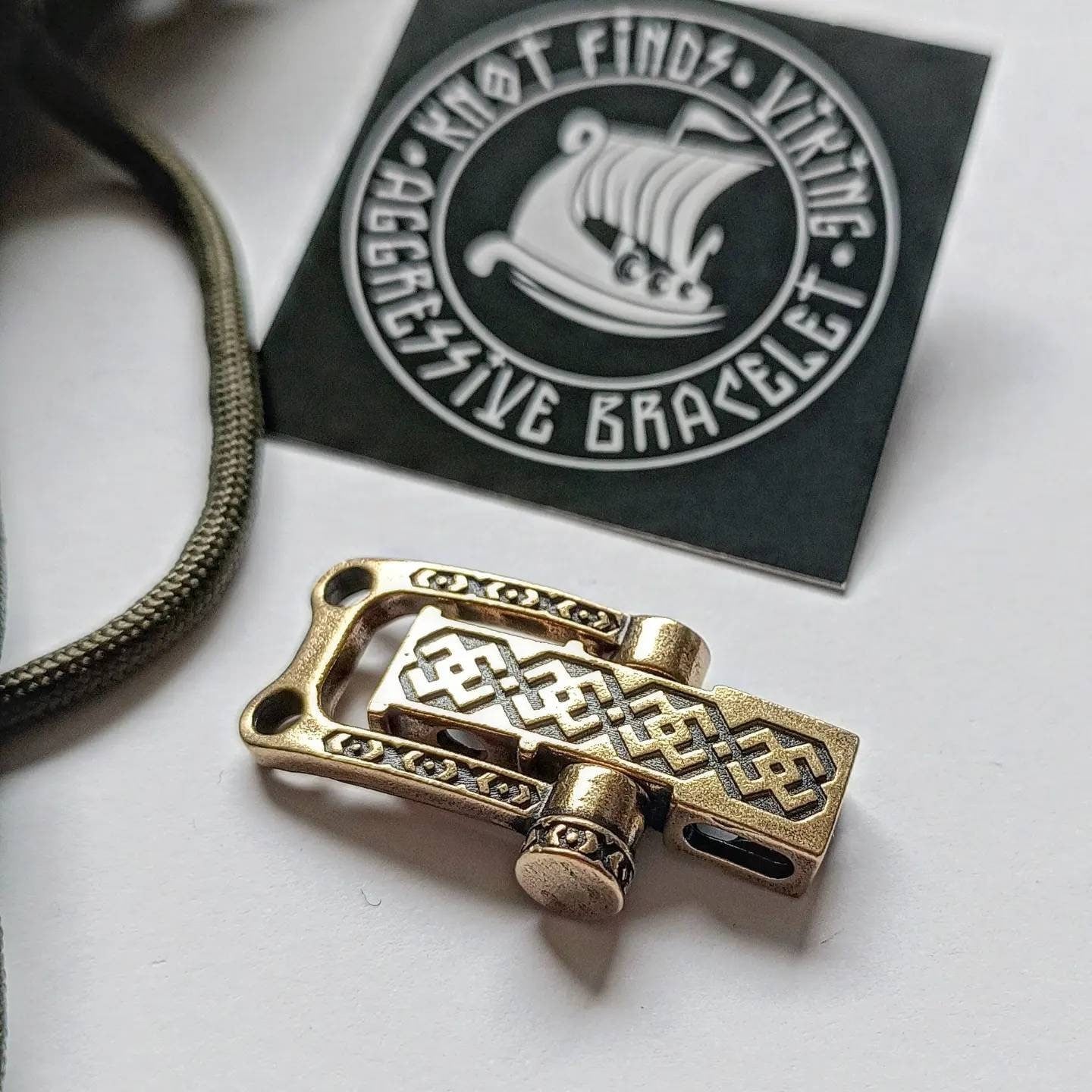 Bracelet lock. Paracord Buckles, U-shaped buckle. Viking-style paracord beads. Viking jewelry, manual casting. Scandinavian symbol.