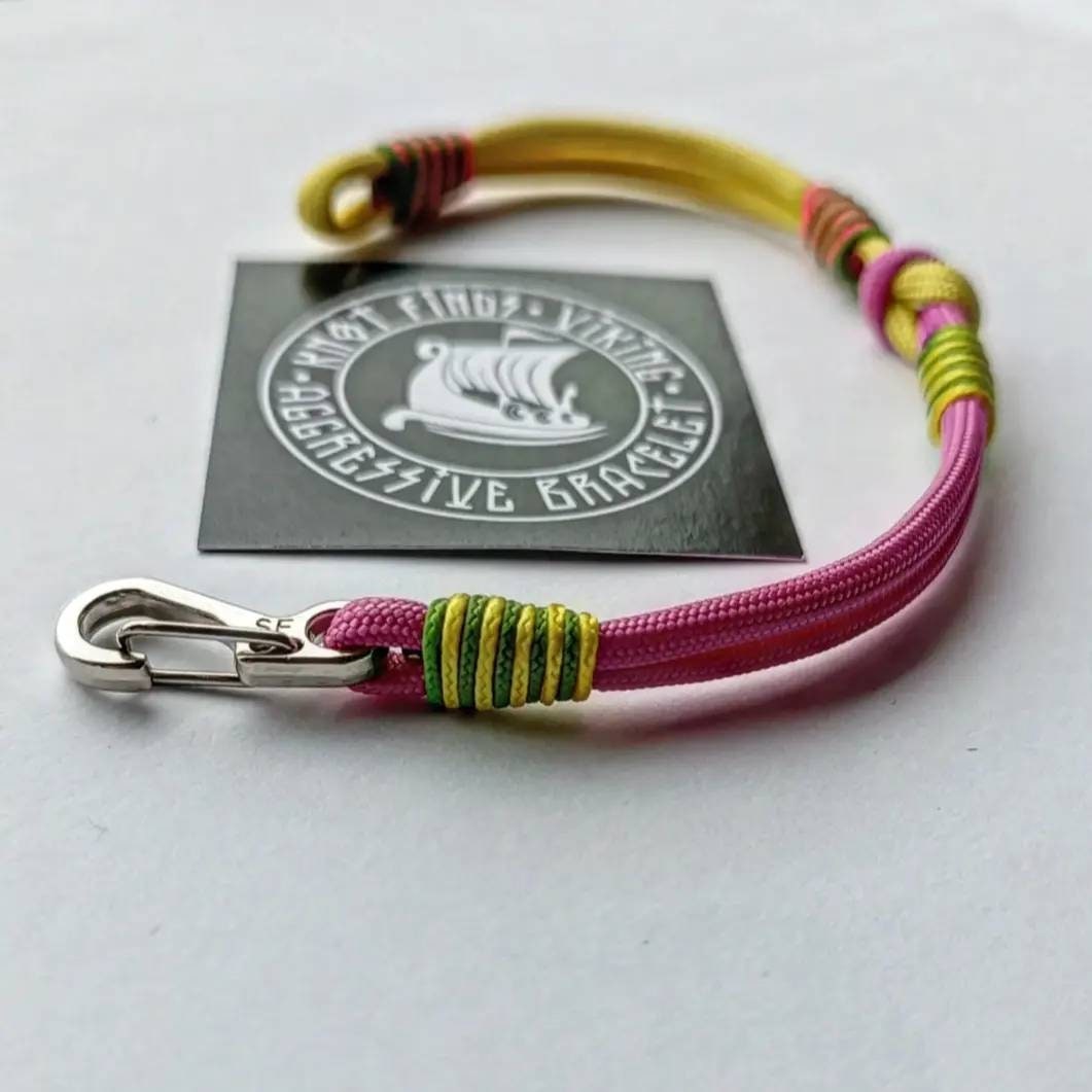 Pink and yellow thin Nordic paracord bangle with a carabiner. Made of parachute cord and celtic knots. Gift for women's.n's to