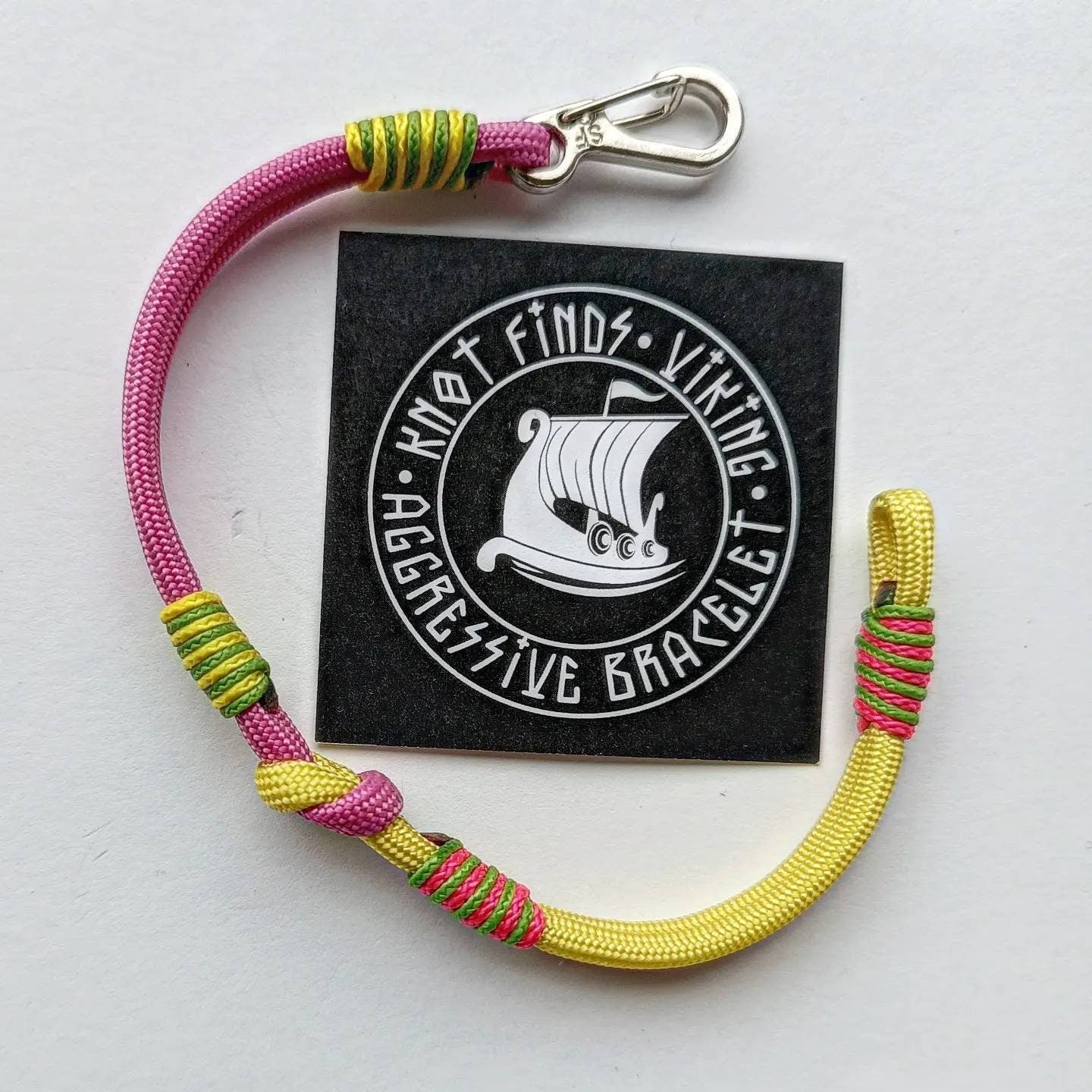 Pink and yellow thin Nordic paracord bangle with a carabiner. Made of parachute cord and celtic knots. Gift for women's.n's to