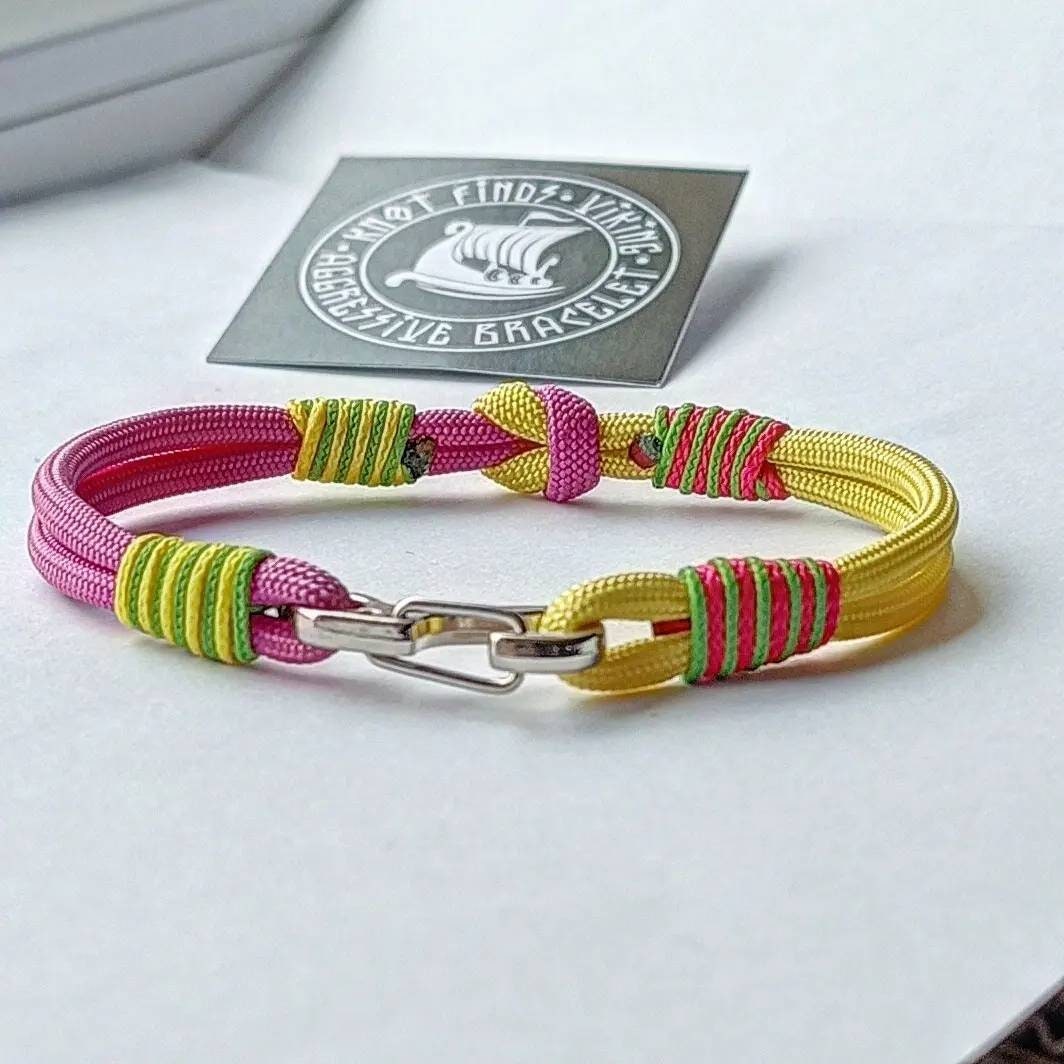 Pink and yellow thin Nordic paracord bangle with a carabiner. Made of parachute cord and celtic knots. Gift for women's.n's to