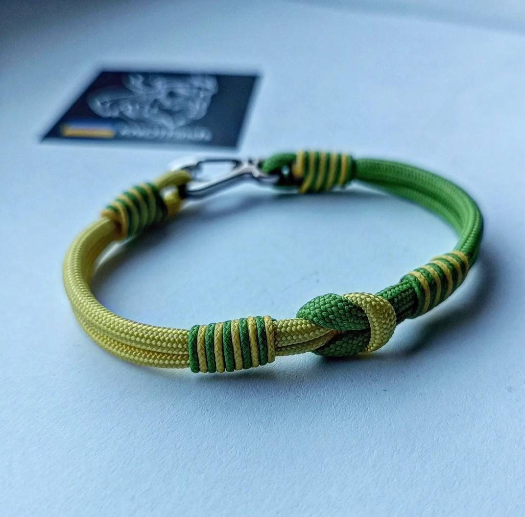 Thin yellow and green mint Nordic paracord bangle with a carabiner. Extreme durable. Gift to a friend for his birthday.