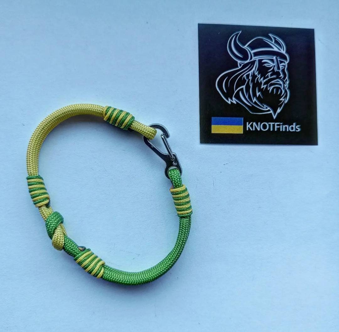 Thin yellow and green mint Nordic paracord bangle with a carabiner. Extreme durable. Gift to a friend for his birthday.