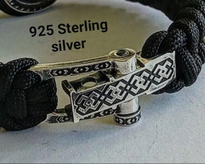 A clasp for paracord or leather bracelets. 925 sterling silver. Viking-inspired sterling silver beads. Handcrafted Viking-inspired jewelry for those seeking unique and stylish accessories.