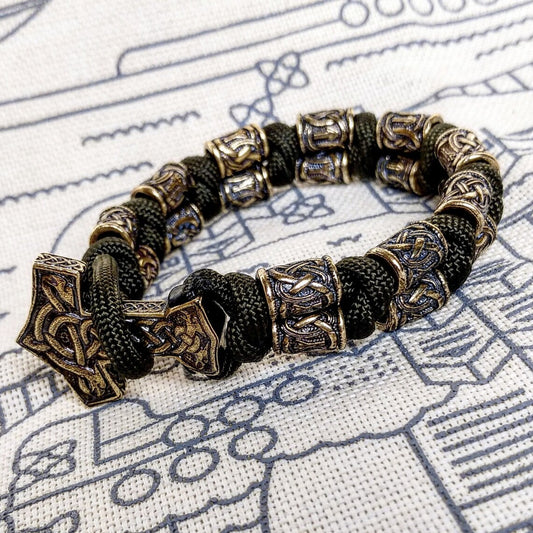 Runic bracelet "VIKING" from a paracord with a clasp "THOR'S HAMMER".  Runes  "teyvaz" and "algiz". Viking style.