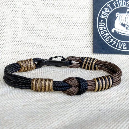 Thin Viking paracord bracelet with a carabiner.  Made of parachute cord and celtic knots.  Gift to a friend for his birthday.