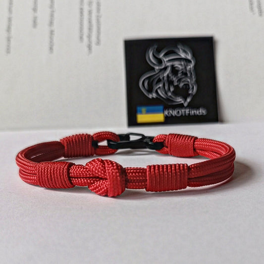 Thin legendary red bracelet. Made of paracord and carabine for men and women. Mystical style. Viking jewelry.