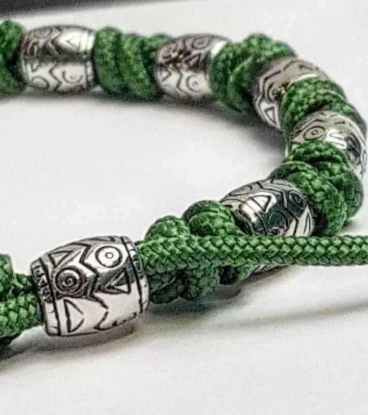 Charming bracelet, Paracord jewelry. Paracord bracelet with beads. Beads with ornaments.