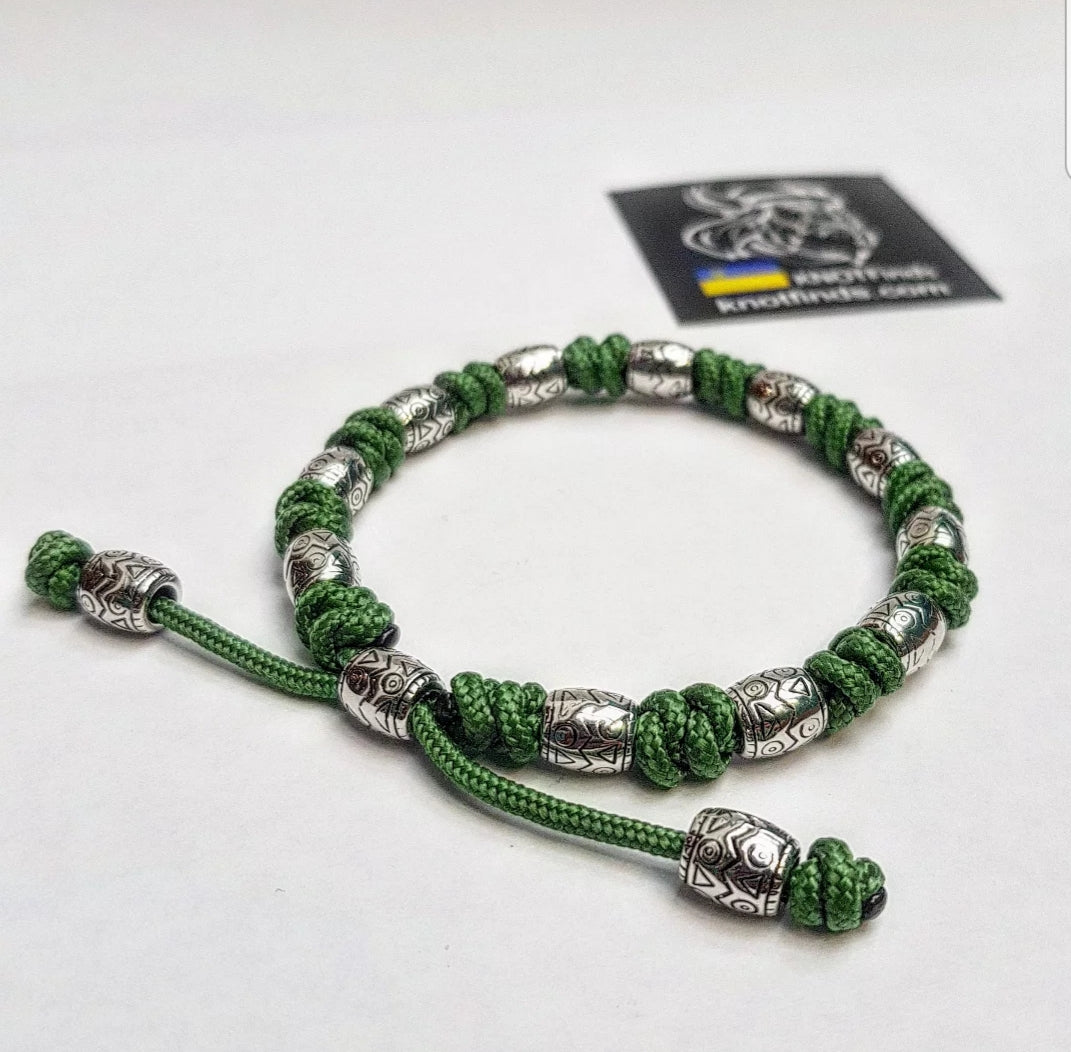 Charming bracelet, Paracord jewelry. Paracord bracelet with beads. Beads with ornaments.