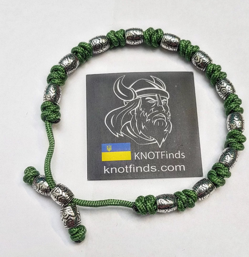 Charming bracelet, Paracord jewelry. Paracord bracelet with beads. Beads with ornaments.