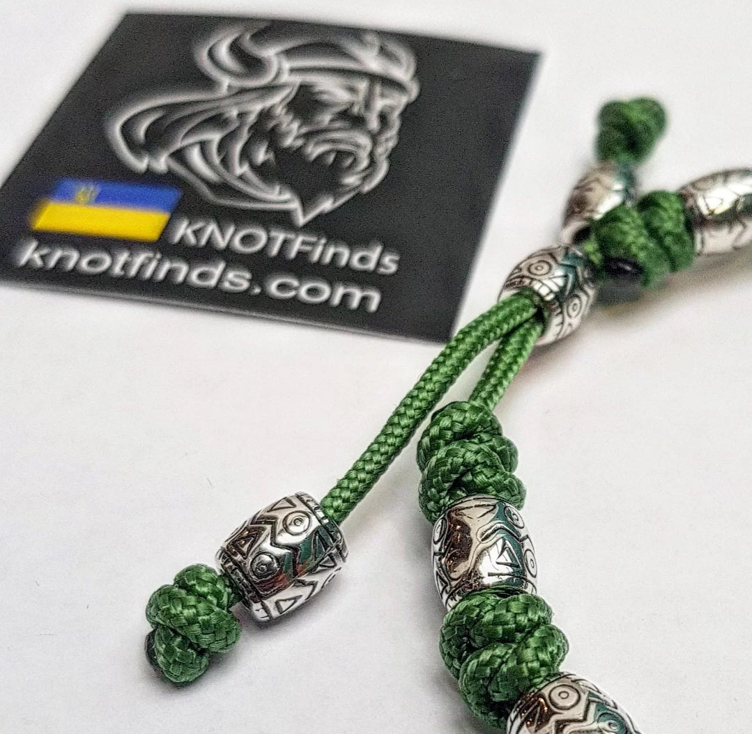 Charming bracelet, Paracord jewelry. Paracord bracelet with beads. Beads with ornaments.