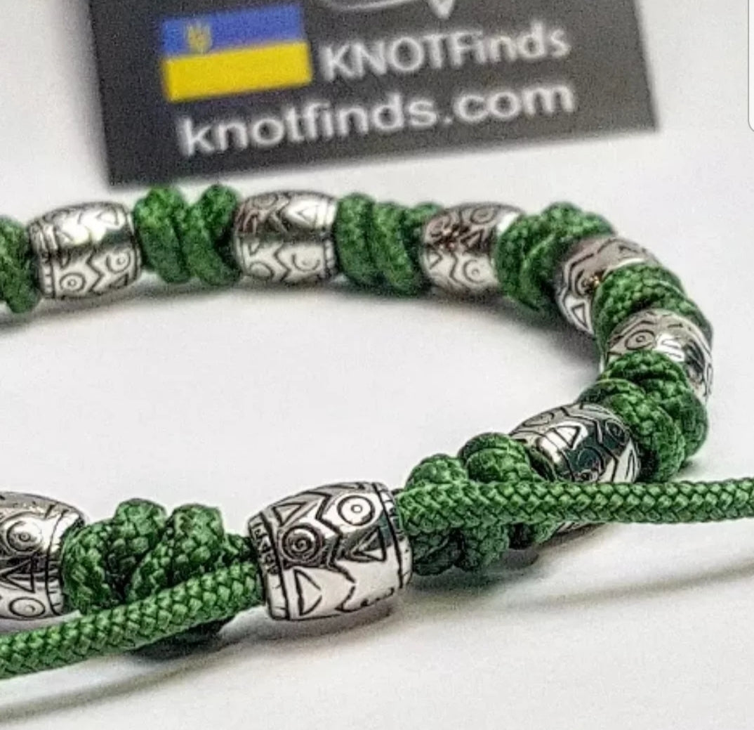 Charming bracelet, Paracord jewelry. Paracord bracelet with beads. Beads with ornaments.