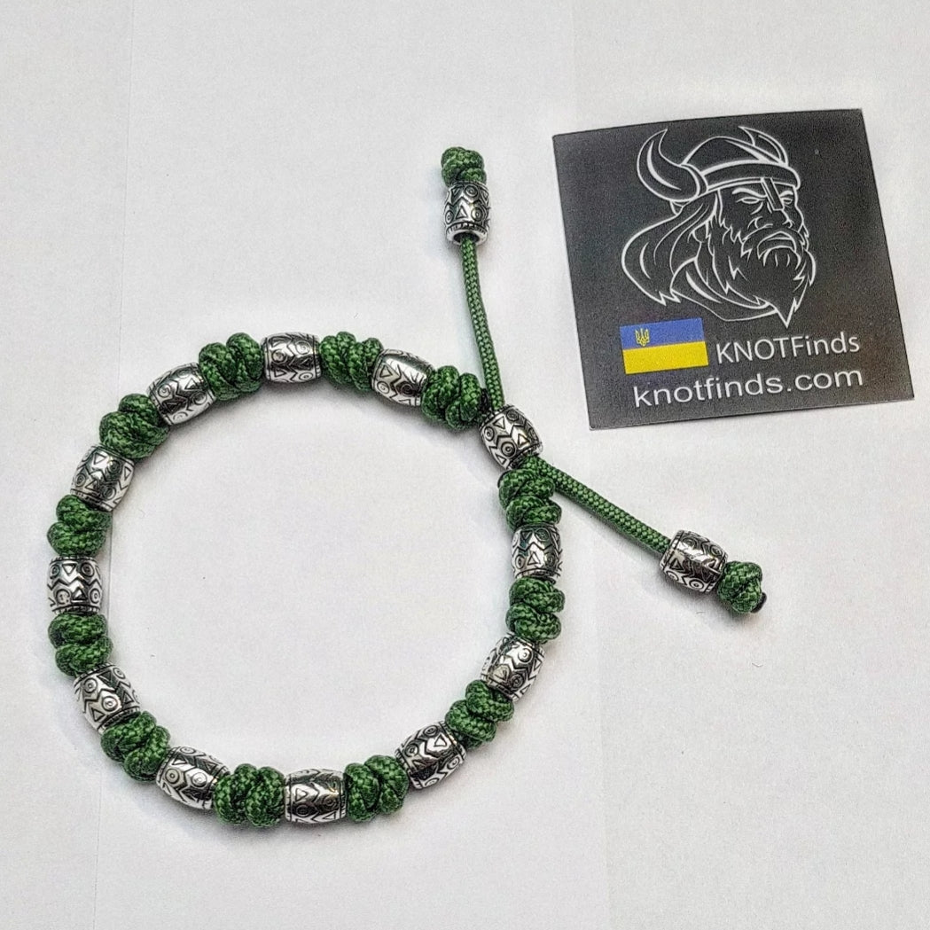 Charming bracelet, Paracord jewelry. Paracord bracelet with beads. Beads with ornaments.