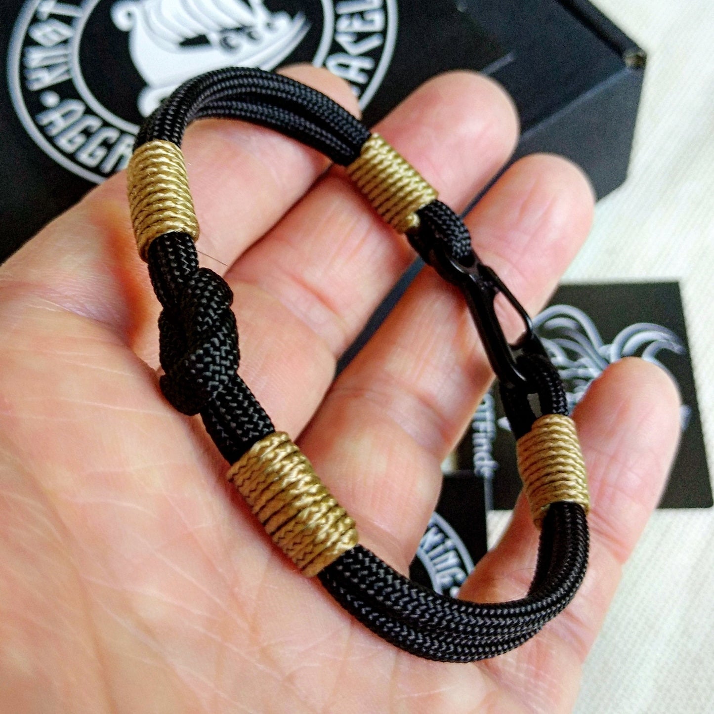 Thin Nordic paracord bangle with a carabiner.  Made of parachute cord and celtic knots.