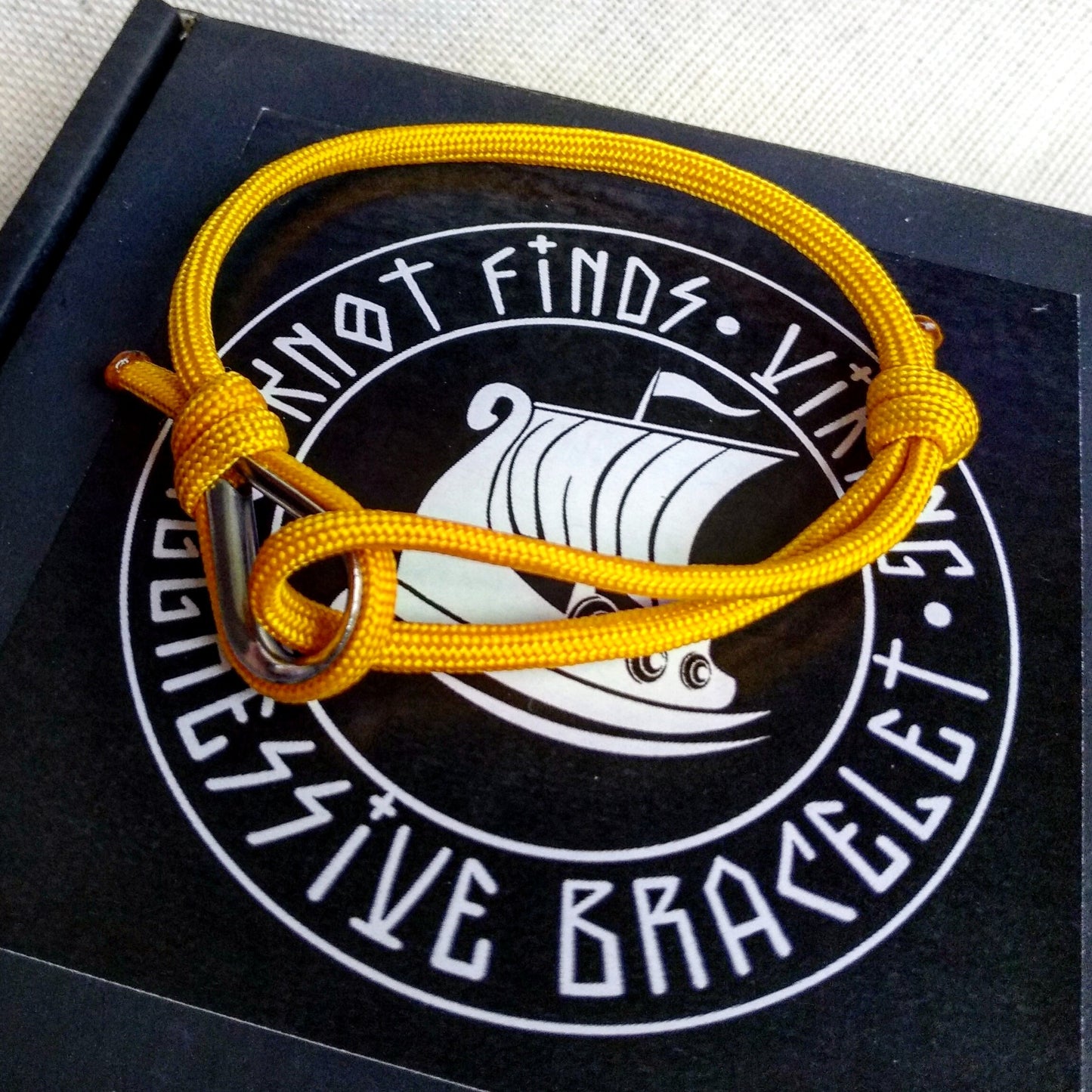 Yellow thin bracelet made of paracord and Celtic knots. Stylish bracelet for men and women. A gift for a surfer, diver, skydiver.