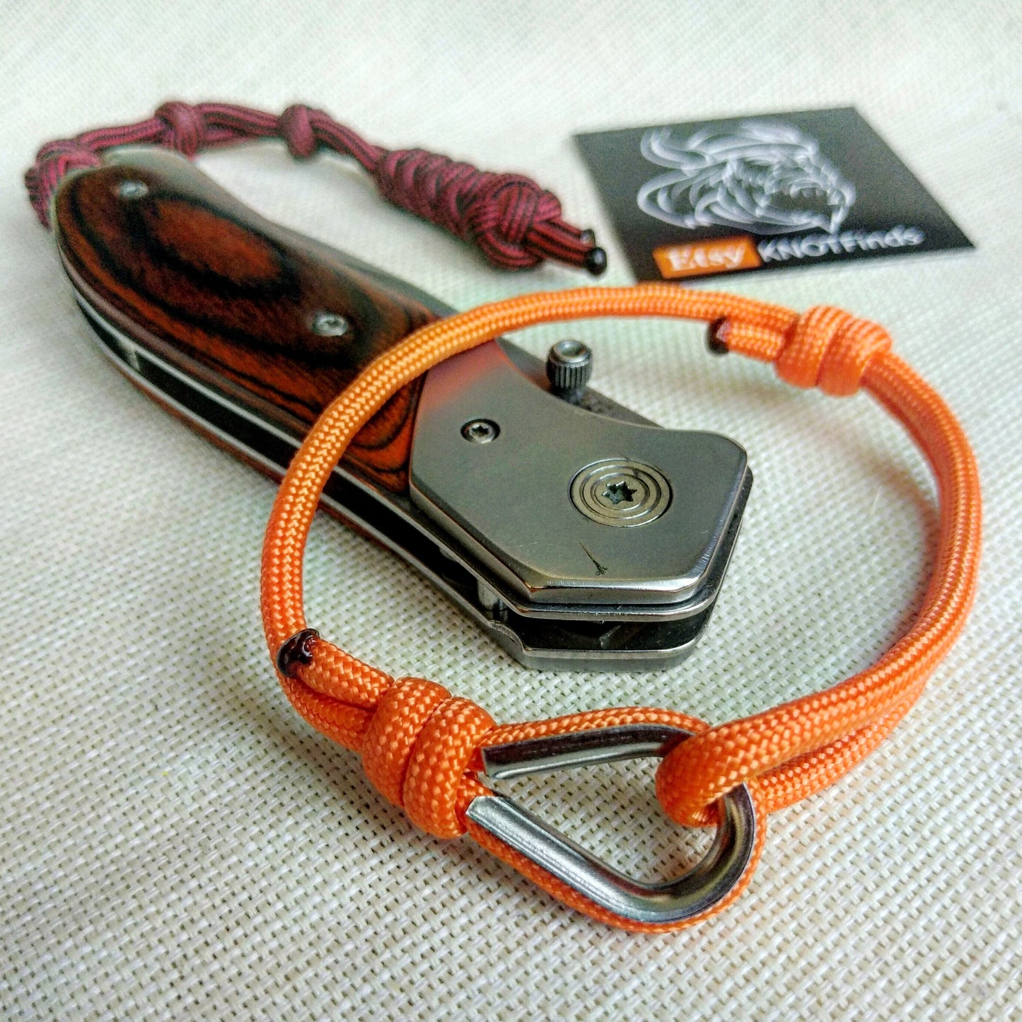 Orange thin bracelet made of paracord and Celtic knots. Stylish bracelet for men and women. A gift for a surfer, diver, skydiver.