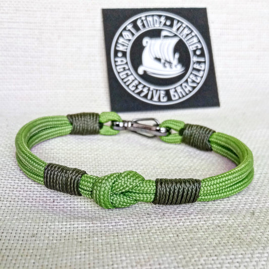 Thin green Viking paracord bracelet with a carabiner.  Made of parachute cord and celtic knots.  Gift to a friend for his birthday.