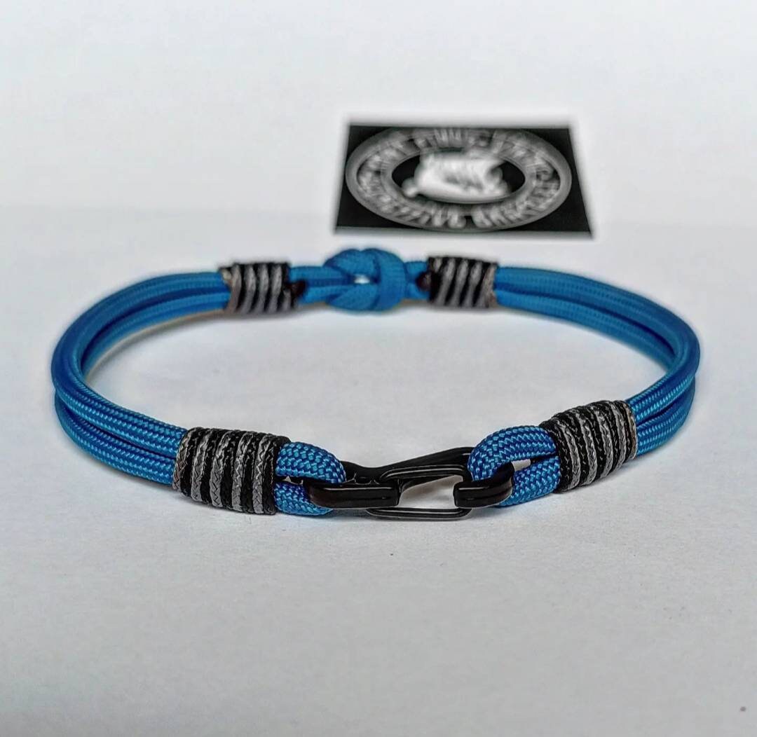Thin military bracelet made of paracord and carabine for men. Royal blue collection. Navy style.