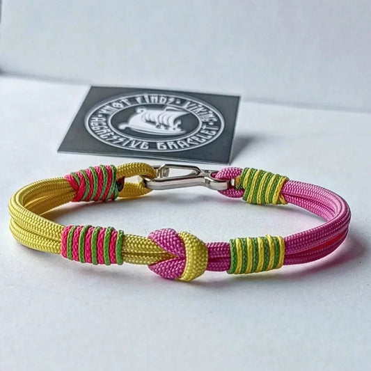 Pink and yellow thin Nordic paracord bangle with a carabiner. Made of parachute cord and celtic knots. Gift for women's.n's to