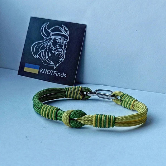 Thin yellow and green mint Nordic paracord bangle with a carabiner. Extreme durable. Gift to a friend for his birthday.